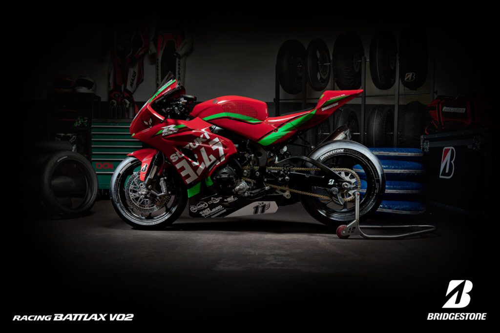 Red Suzuki motorcycle with racing Battlax V02 tyres 
