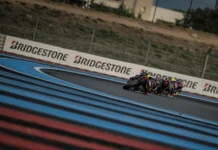 Seven Bridgestone-backed teams ready for the 2026 FIM Endurance World Championship Two motorcycle racers leaning into a corner on a racetrack, with Bridgestone-branded barriers lining the track.
