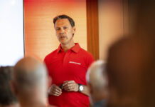 Leading with Passion: A Conversation with Nico Thuy, Director of Bridgestone’s Motorcycle Business "Nico Thuy, Bridgestone's EMEA Motorcycle Business Director, presenting to journalists at the T33 launch event"